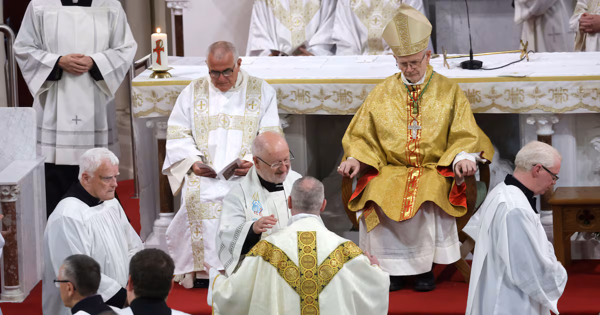 Cleric Celebrates New Priest's Ordination in Downpatrick