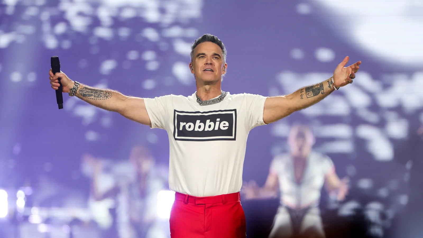 Robbie Williams Discusses Overcoming Imposter Syndrome